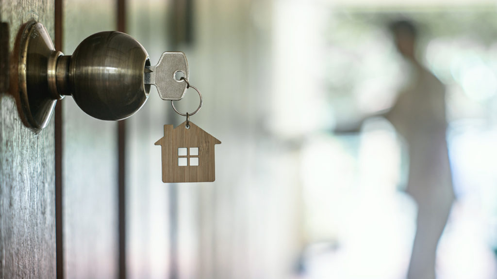 An Image of door lock with a key