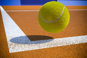 Tennis ball landing on sideline