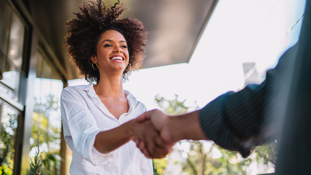 An image showing a girl shaking hand