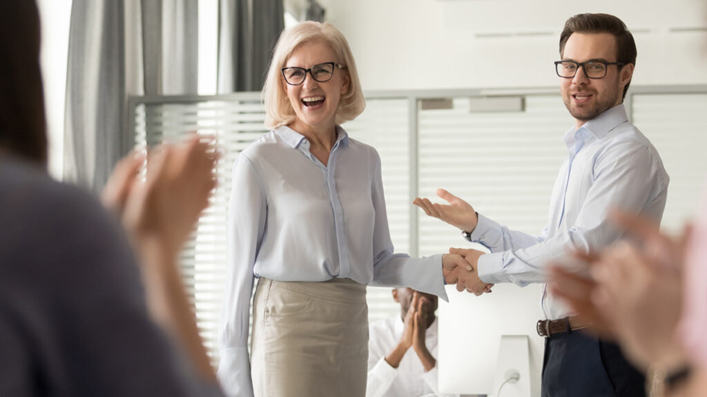 An image showing a real estate agent giving respect and value to his client